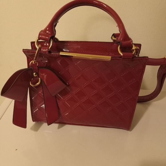 Handbags - Red patin leather crossbows bag. Still in good condition.
